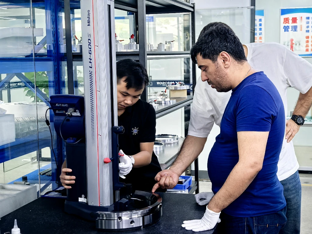 Customer on-site inspection of CNC machined parts with Mitutoyo height gauge